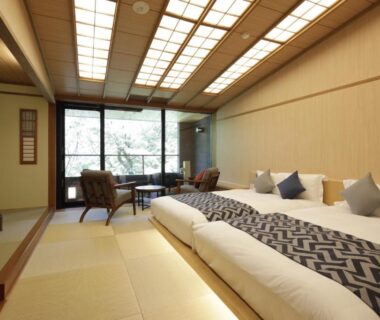 Tatami room with three low beds and seating by window, Centurion Hakone Bettei Kanagawa Japan