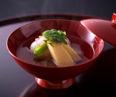 Lacquer bowl of clear soup with bamboo shoots and greens at Charoku Bekkan Kyoto