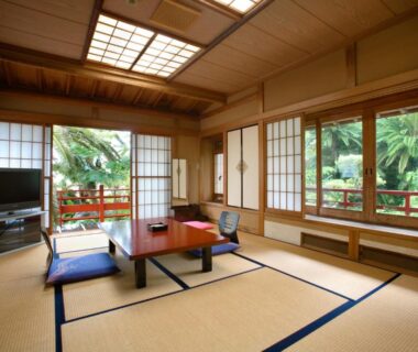 Tatami room with low table, zabuton cushions and shoji windows at Chikurakan in Chiba, Kantō