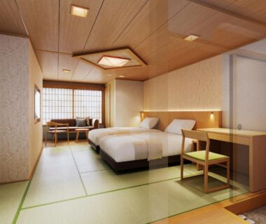 Tatami room with twin beds, shoji screens and low seating at Club Wyndham Chikumakan Nagano Chūbu Japan