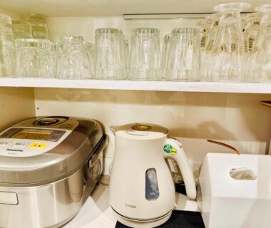 Shelf with glassware, electric kettle and rice cooker at DP小山町Machida, Tokyo