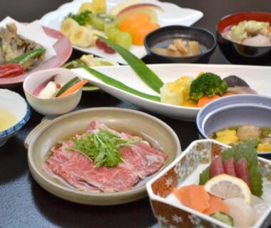 Assorted Japanese dishes with sashimi and thinly sliced beef at Dai Onsen Matsudaya Ryokan, Iwate