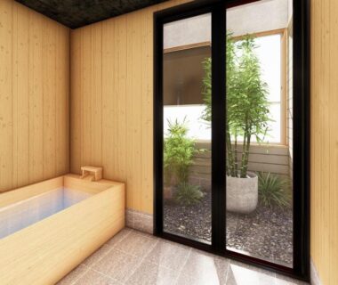 Indoor wooden soaking tub with sliding doors opening to a small garden at Dai Onsen Matsudaya, Iwate, Tōhoku, Japan