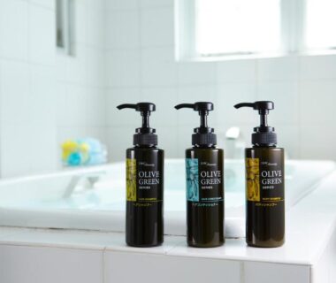 Three pump bottles on bathtub edge at Day Nice Hotel Tokyo