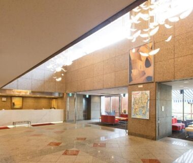 Open marble lobby with reception desk and lounge seating at Day Nice Hotel Tokyo, Kantō region