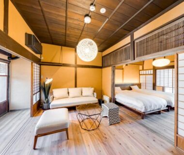 Spacious Japanese-style room with shoji screens, twin beds and sofa at EN Takeda Castle Town Hotel, Hyōgo, Kansai