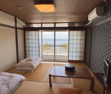 Tatami room with futons, low table and shoji doors at Eboshiso in Iwate Tōhoku Japan
