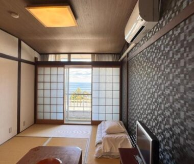 Tatami room with futon and shoji doors at Eboshiso, Iwate Japan