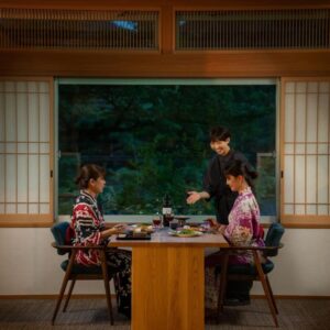 Two women in kimono dining in a tatami room at Eirakukan ryokan, Fukushima, Tōhoku