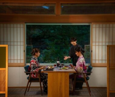 Two women in kimono dining in a tatami room at Eirakukan ryokan, Fukushima, Tōhoku