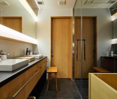 Wooden bath, dual sinks, and glass shower doors in Enso Machiya bathroom, Kyoto, Kansai, Japan