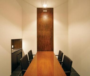 Minimal dining area with long wooden table and dark chairs at Four Seasons Yuzawa Quattro, Niigata