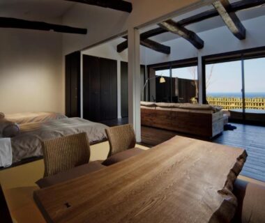 Wooden soaking tub, twin beds and balcony water view at Fugaku Gunjo, Shizuoka, Chūbu Japan