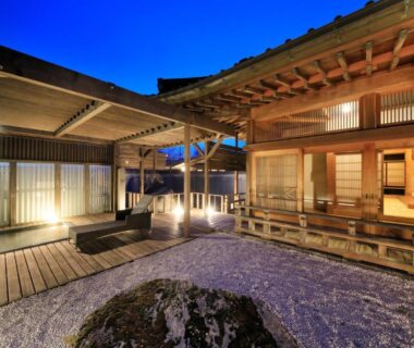 Evening wooden courtyard with engawa, shoji screens and gravel garden at Fuji Onsenji Yumedono