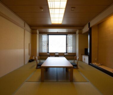 Tatami room with low table and shoji screens at Fujikawaguchiko Onsen Konanso, Yamanashi