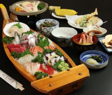 Sashimi and tempura with assorted side dishes on wooden boat, Fujimien, Chūbu Yamanashi