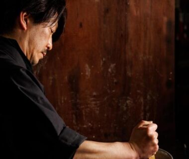 Person stirring a large pot in Fukashiso kitchen, Nagano, Chūbu