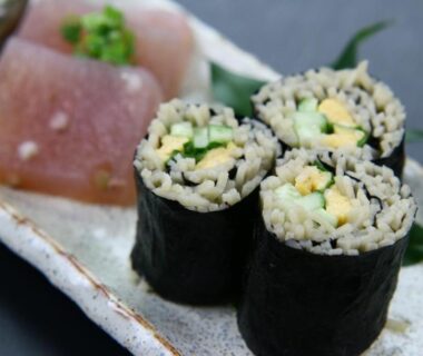 Maki rolls and fish nigiri on ceramic plate at Fukuichi, Yamanashi