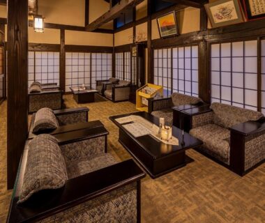 Cozy shoji-screened lounge with armchairs and low tables at Furusato in Gifu
