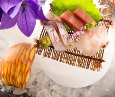 Sashimi on crushed ice with edible flowers at Gekkoju Kurokawa in Kumamoto, Kyushu