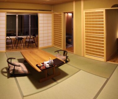 Traditional tatami room with low table, shoji screens and seating at Gero Onsen Yukyunohana, Gifu