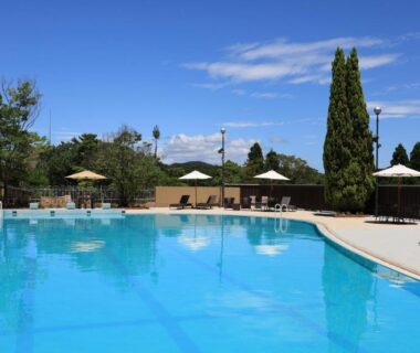 Outdoor pool with loungers and umbrellas at Ginsuisou Choraku, Hyōgo, Kansai, Japan