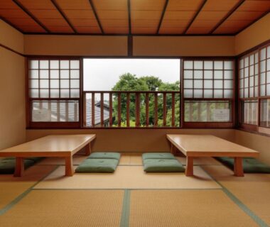 Tatami room with low tables and shoji screens at Gion Ryokan Q-beh in Kyoto, Kansai