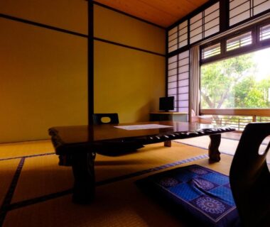 Traditional tatami room with low table and shoji screens at Good Stay Mizuho, Oita, Kyushu