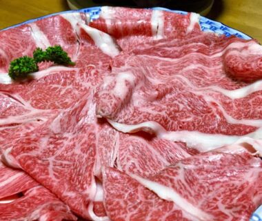 Thinly sliced marbled beef arranged on a platter at Good Stay Mizuho, Ōita