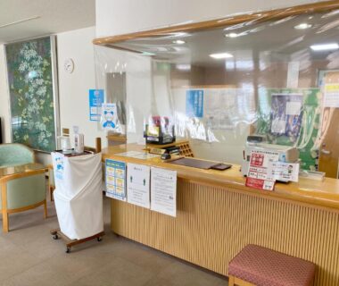 Reception counter with brochures and seating at Green Spa Tsutsuga, Chūgoku Hiroshima