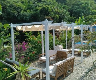 Outdoor pergola seating and wooden benches at Guest House Churaumi, Shizuoka, Chūbu Japan