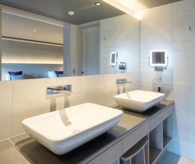 Contemporary double sink bathroom with illuminated mirror at HAKONE NICA, Kanagawa, Japan