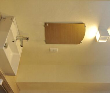 Compact sink and wooden framed mirror in guest house bathroom at HESTA Hakone, Kanagawa, Kantō