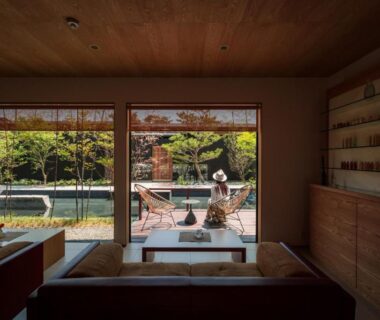 Interior lounge with low seating and sliding doors to garden at HOSHINO-OTOー星音 Kyoto
