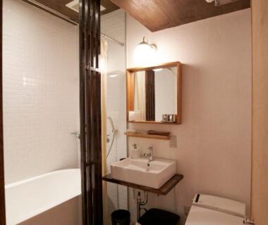 Compact bathroom with tub, sink and toilet at HOTEL Clam Chowder in Kyoto, Kansai