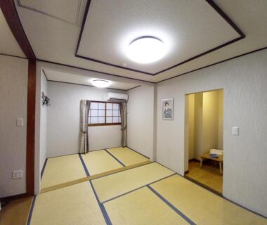Japanese tatami room with mat flooring, window and small alcove at HOTEL HOUSE LEE, Tokyo