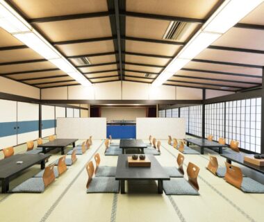 Spacious tatami dining hall with low tables and zabuton at HOTEL SHIRAHAMAKAN in Wakayama, Kansai
