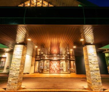 Nighttime hotel entrance with stone pillars at Hachimantai Mountain Hotel & Spa, Iwate Tōhoku