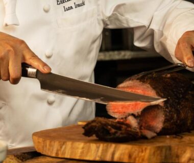 Chef slicing roast meat for dining at Hachimantai Mountain Hotel & Spa in Iwate Tōhoku