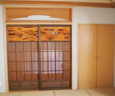 Traditional tatami room with shoji screens and carved wooden transom at Hagurokan in Yamagata, Tōhoku, Japan