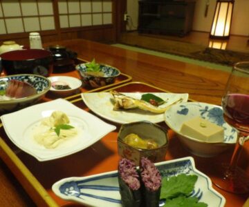 Assorted small Japanese dishes on tray in tatami room at Hagurokan, Yamagata
