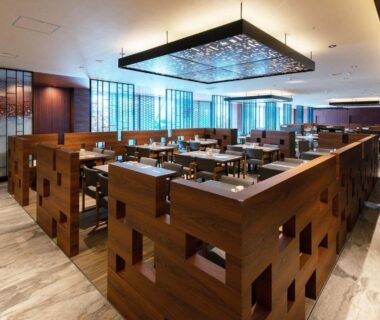 Spacious modern dining area with wooden partition booths and table seating at Hakodate Kokusai Hotel Hokkaidō