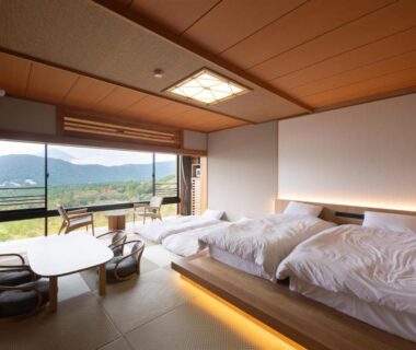 Spacious tatami room with futon-style beds and low table at Hakone Ashinoko Bikeikan, Kanagawa, Kantō, Japan