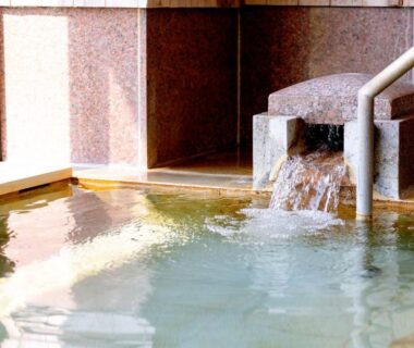 Indoor onsen bathing area with stone spout, Hakone Ashinoko Bikeikan, Kanagawa Japan
