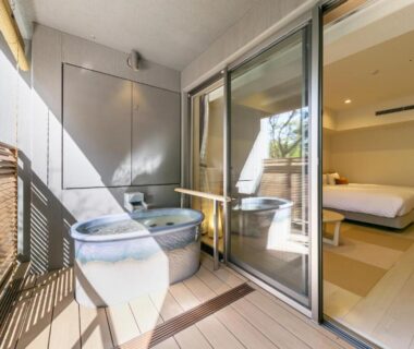 Balcony with two round soaking tubs opening to the guest room at Hakone Ashinoko Hanaori, Kanagawa