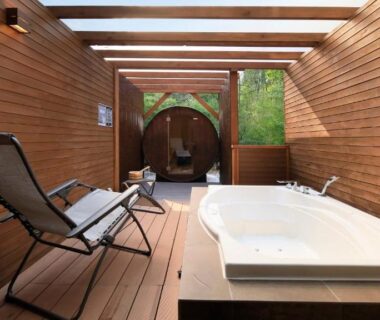 Sunlit wooden deck with bathtub and lounge chair at Hakone Fuga Adult Only in Kanagawa, Kantō, Japan
