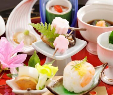 Traditional plated Japanese dishes with decorative garnishes on lacquer tray for ryokan dining at Hakone Fura, Kanagawa