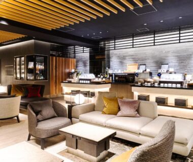Spacious lounge with sofas, low tables and refreshment counter at Hakone Gora KARAKU in Kanagawa