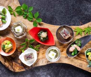 Small ceramic bowls with garnishes arranged on a wooden serving board at Hakone Gora KARAKU, Kanagawa