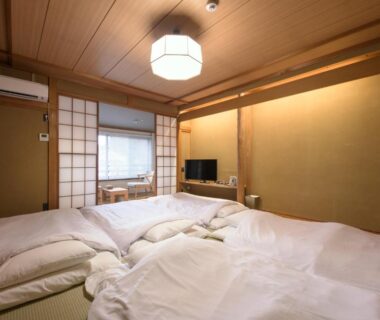 Tatami room with futon bedding, shoji screens and low table at Hakone Gora Ten, Kanagawa